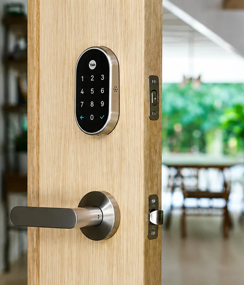Yale smart lock keypad and lever handle fitted to an oak front door