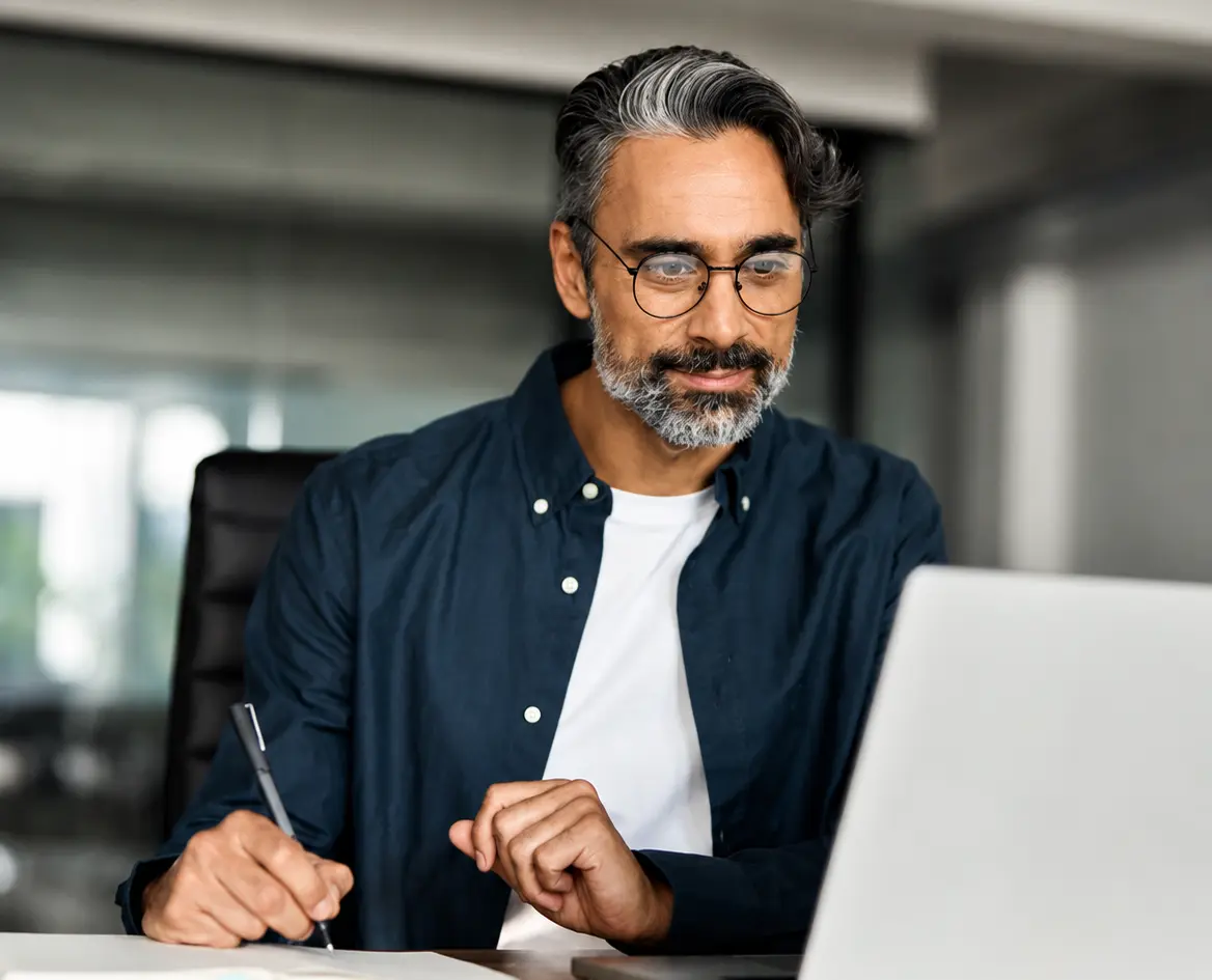 Property owner signing a Staymo management agreement on a laptop