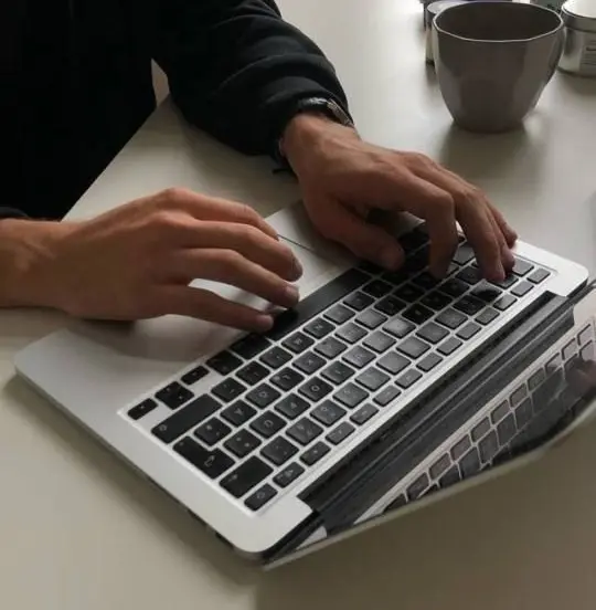 Property manager working on a laptop