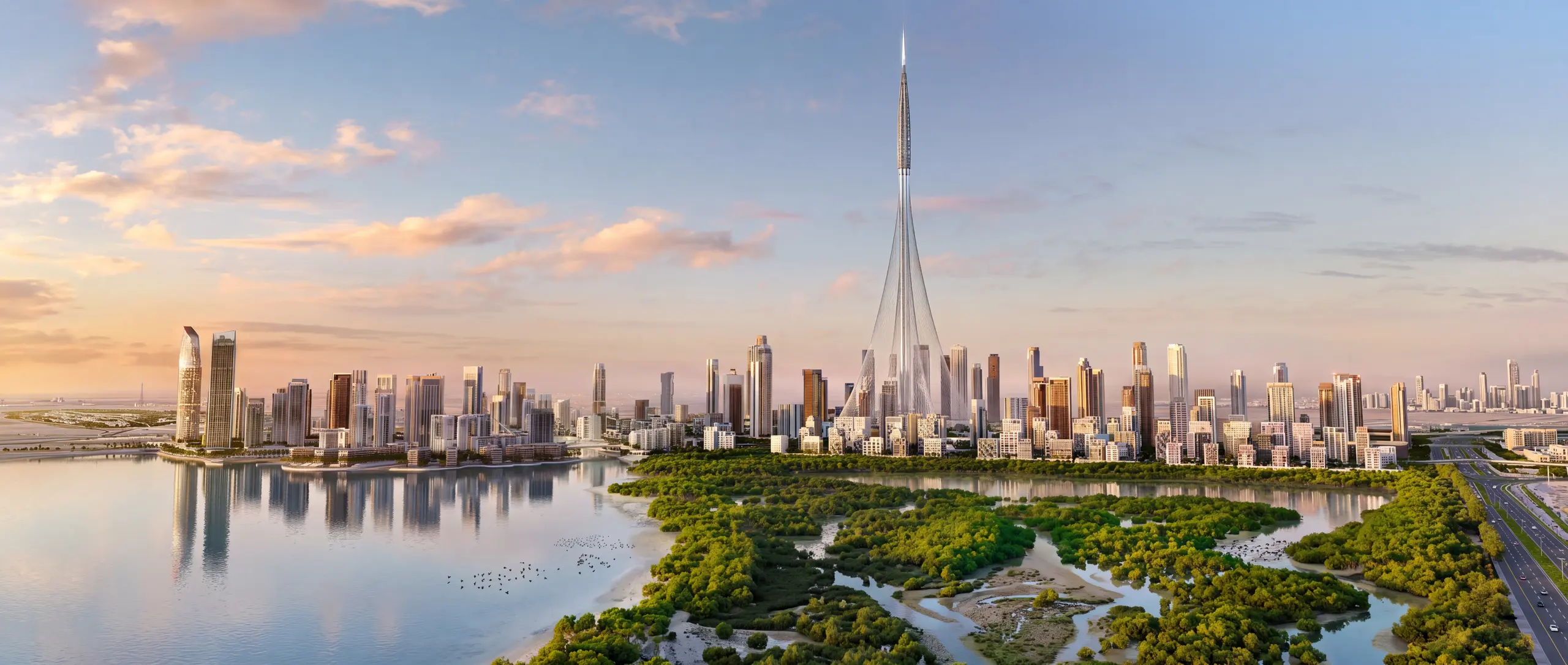 Dubai Creek Harbour towers across the water, with mangroves in the foreground at sunrise
