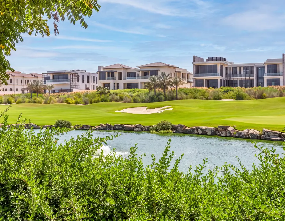 Villas beside a golf course lake