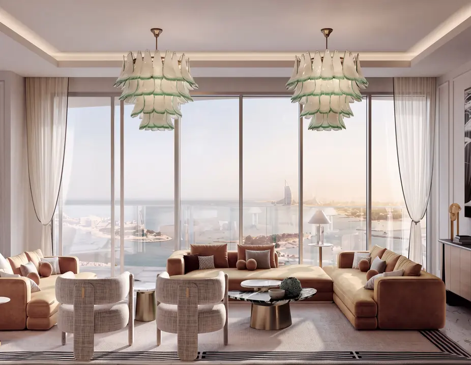 Living room with chandeliers and floor-to-ceiling windows facing the sea