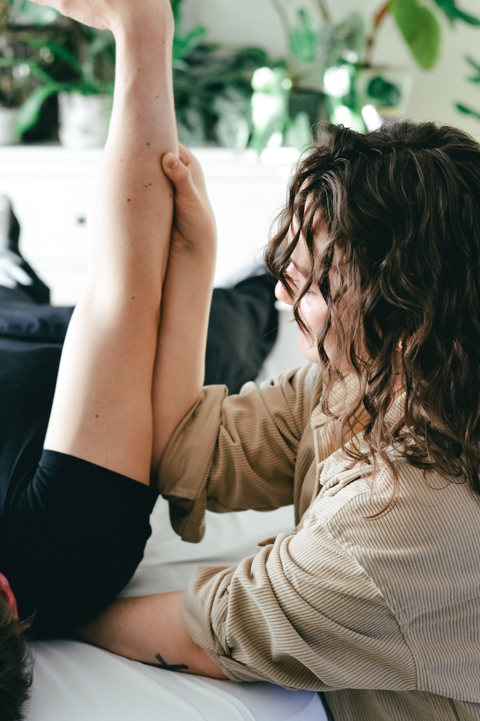 Rolfer working with a client’s arm