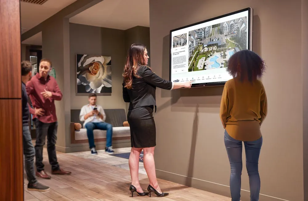 Sales manager in busy leasing office touring with TouchTour