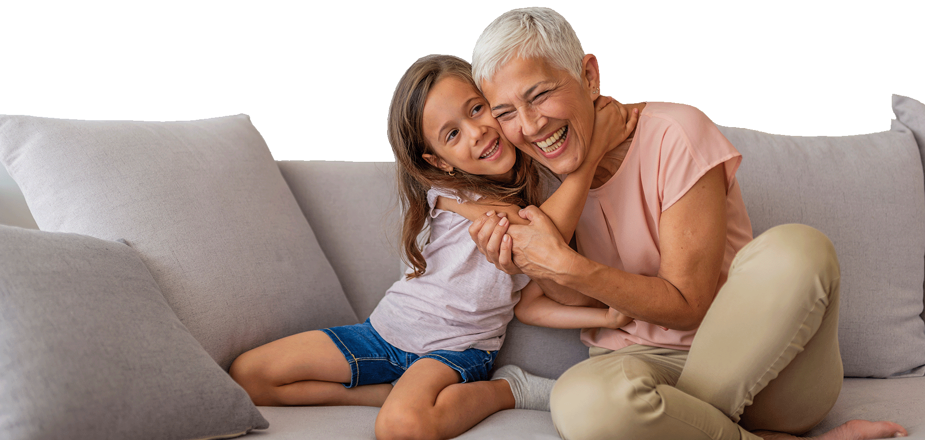 Happy Grandparent with Grandchild on Sofa