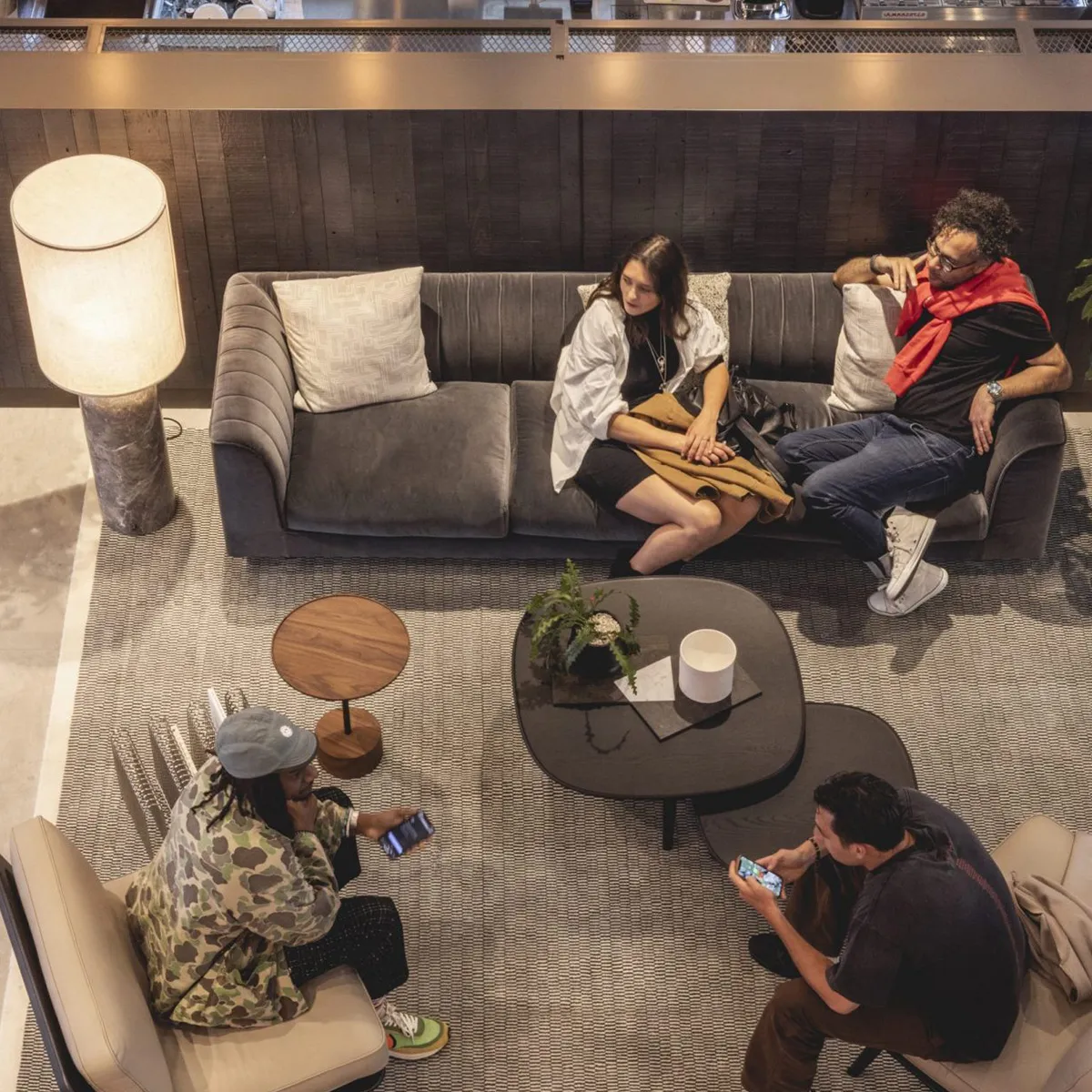 A group of people sitting around a living room together