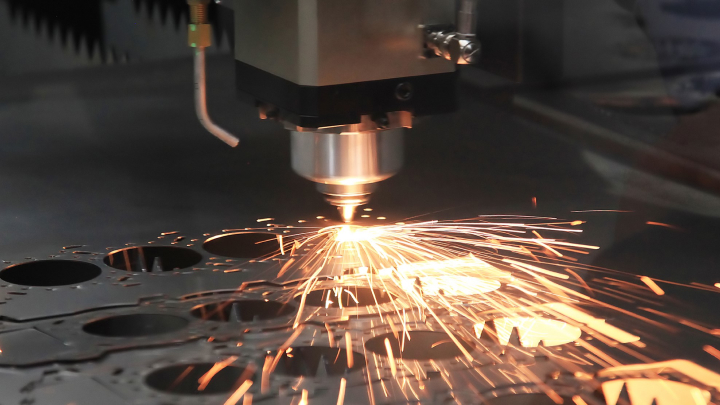 A Trumpf laser cutter cuts a sheet of metal