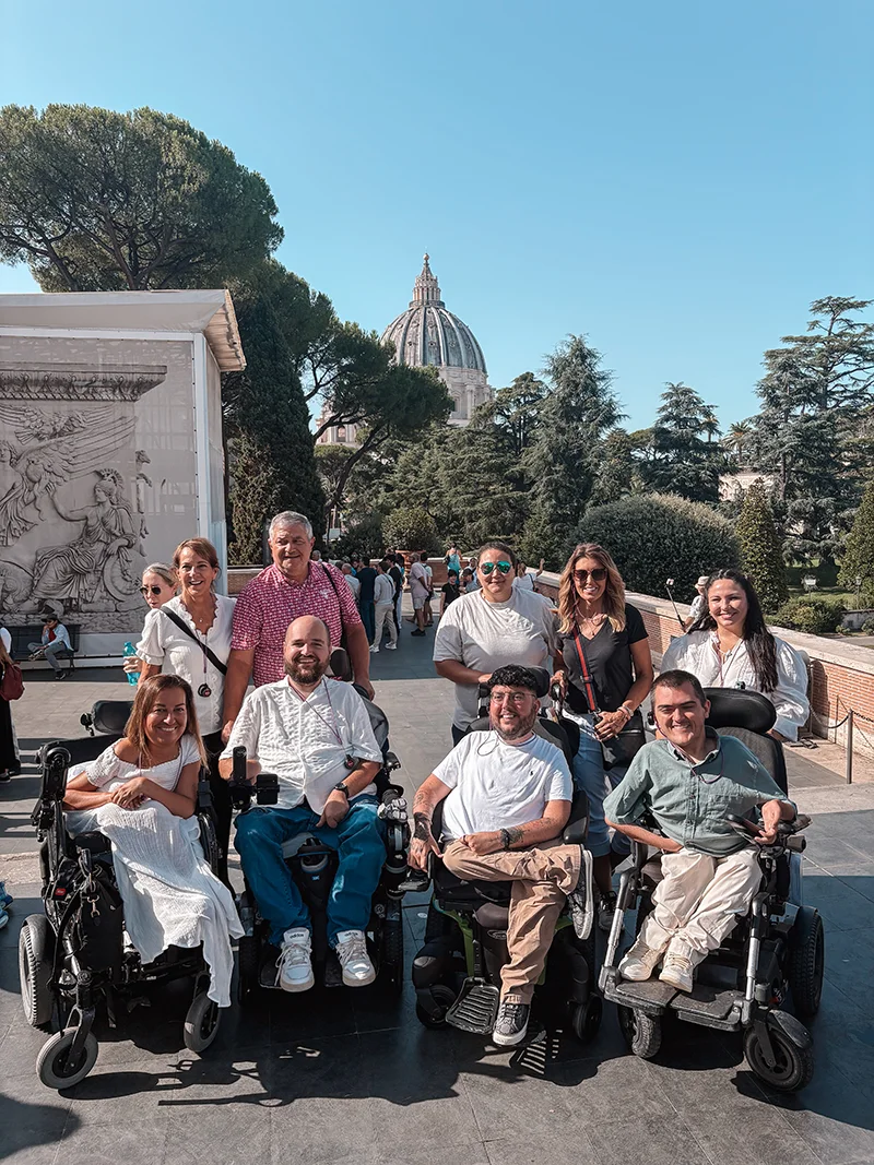 A group photo with the St. Peter's Basilica in the background