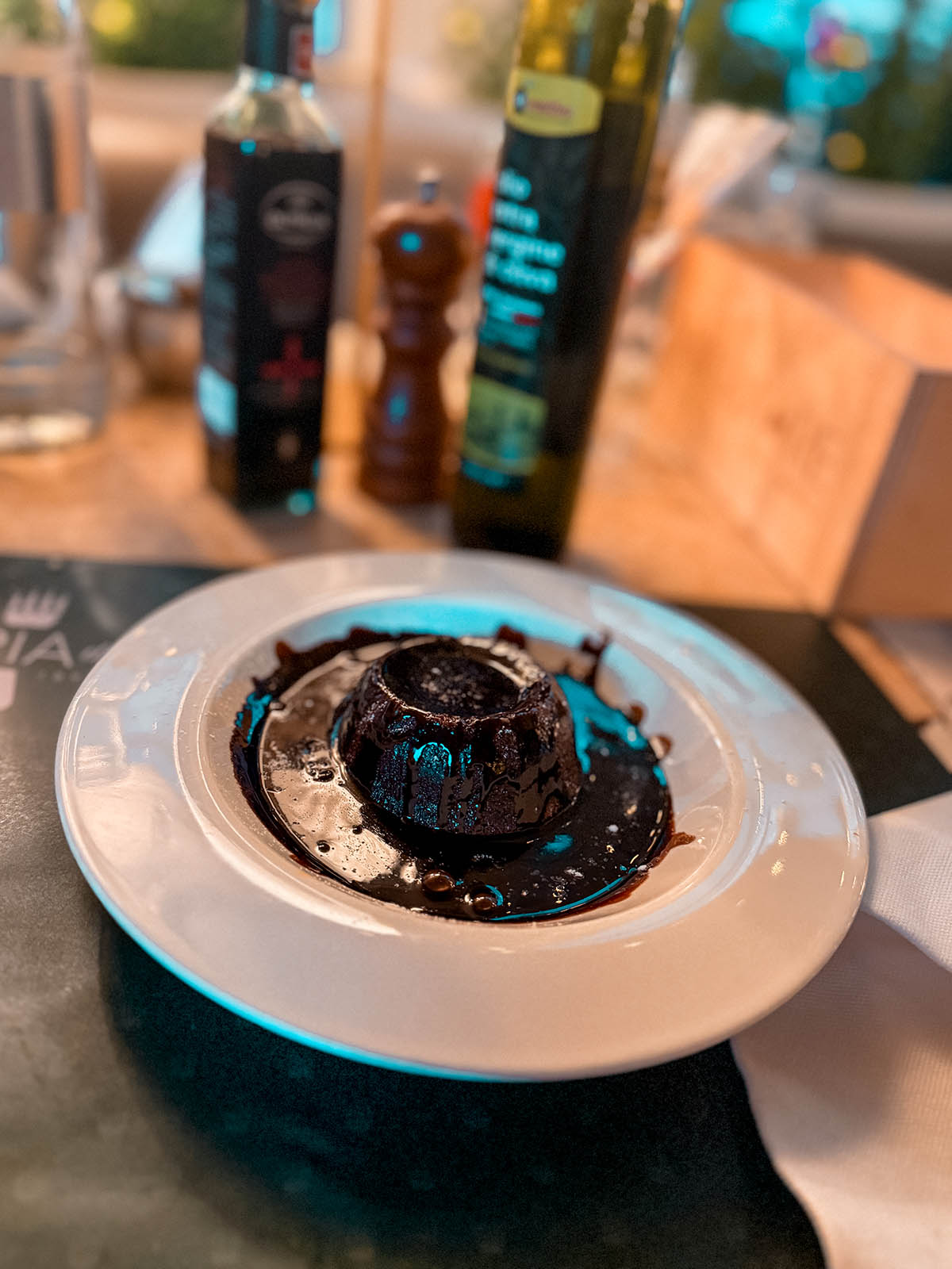 chocolate soufflé dessert covered in chocolate sauce