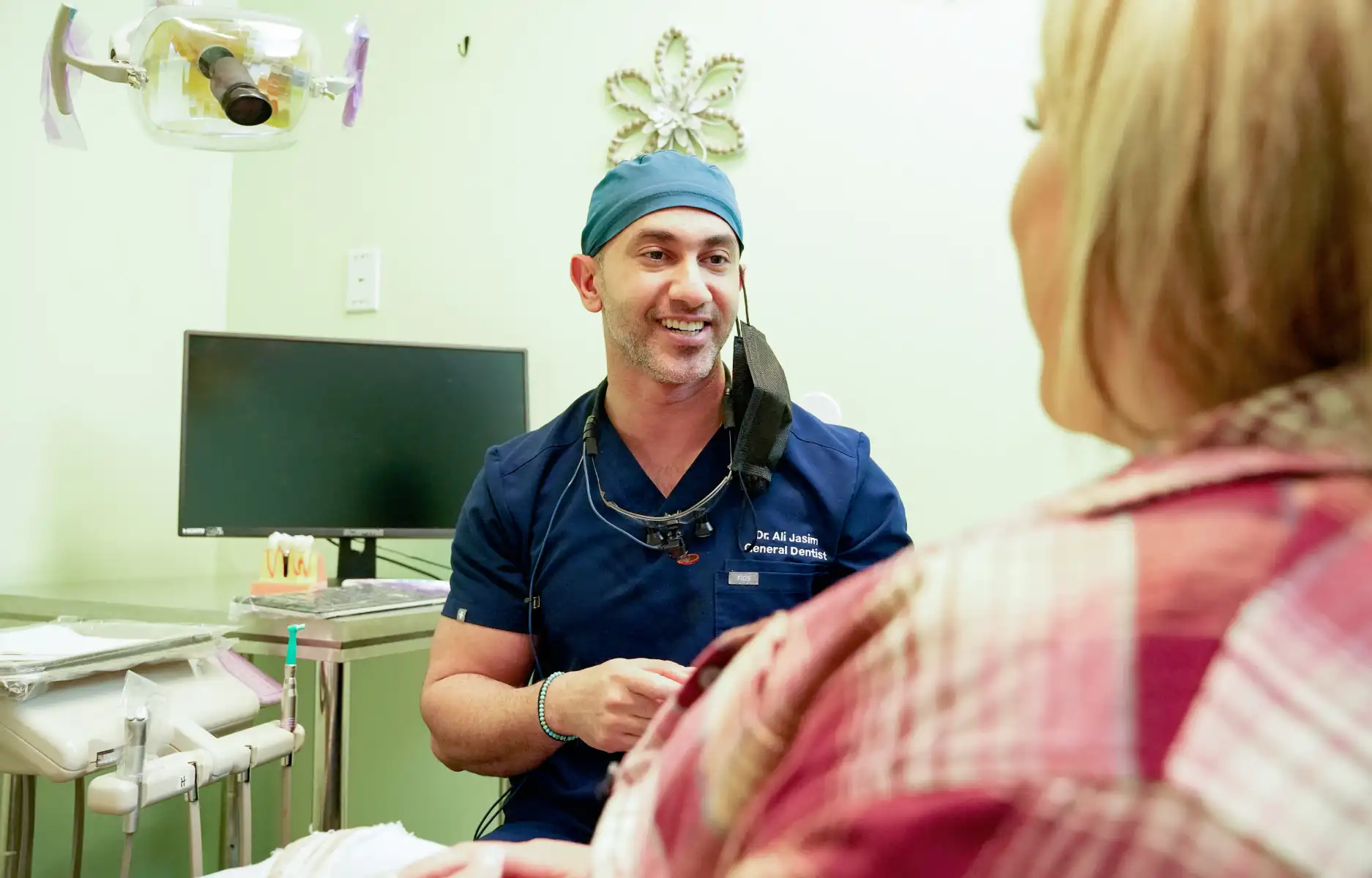 Dentist consulting with patient