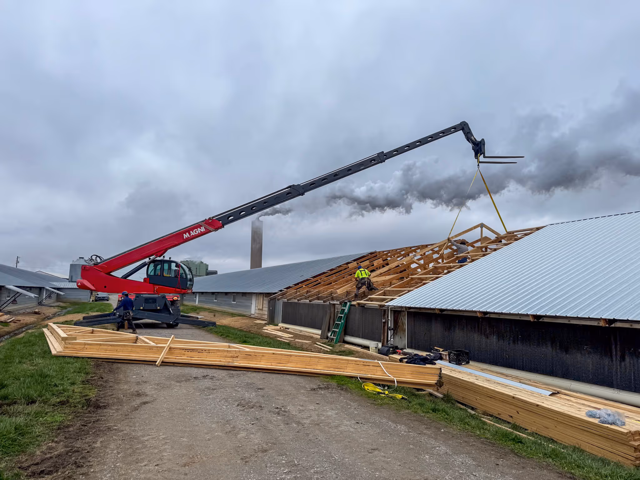 Zoomed out photo featuring our telehandler's reach during a truss project