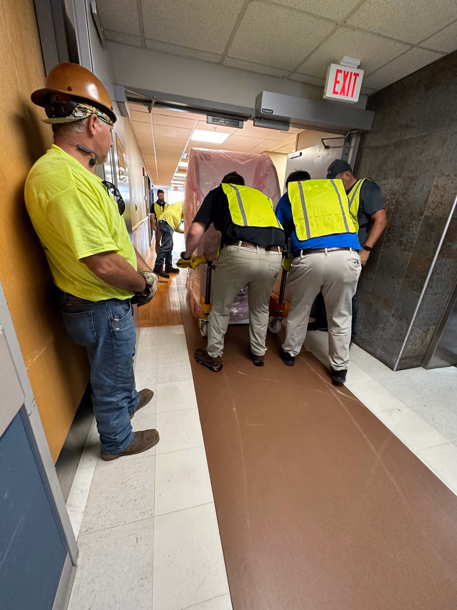 An MRI being wheeled through a hospital