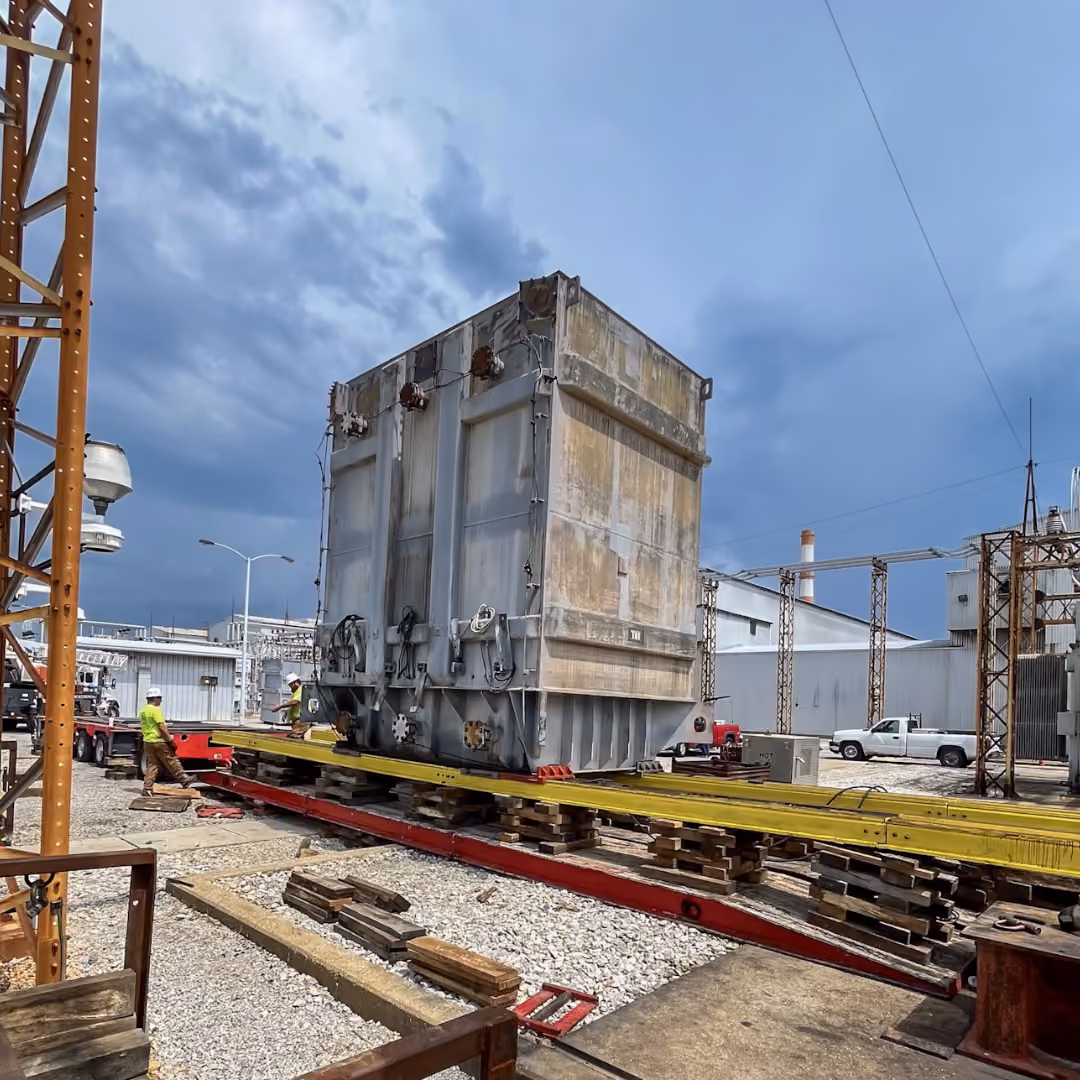 A transformer being moved via jack & slide