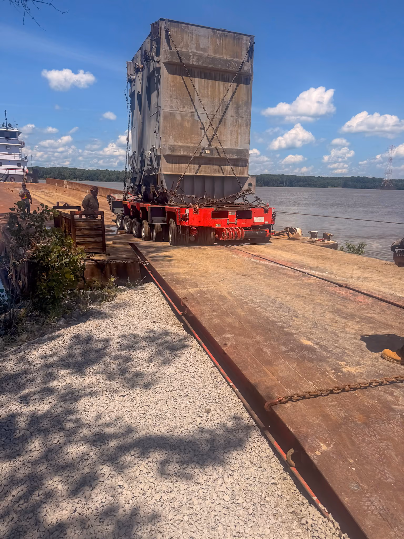 A transformer being transported off a barge