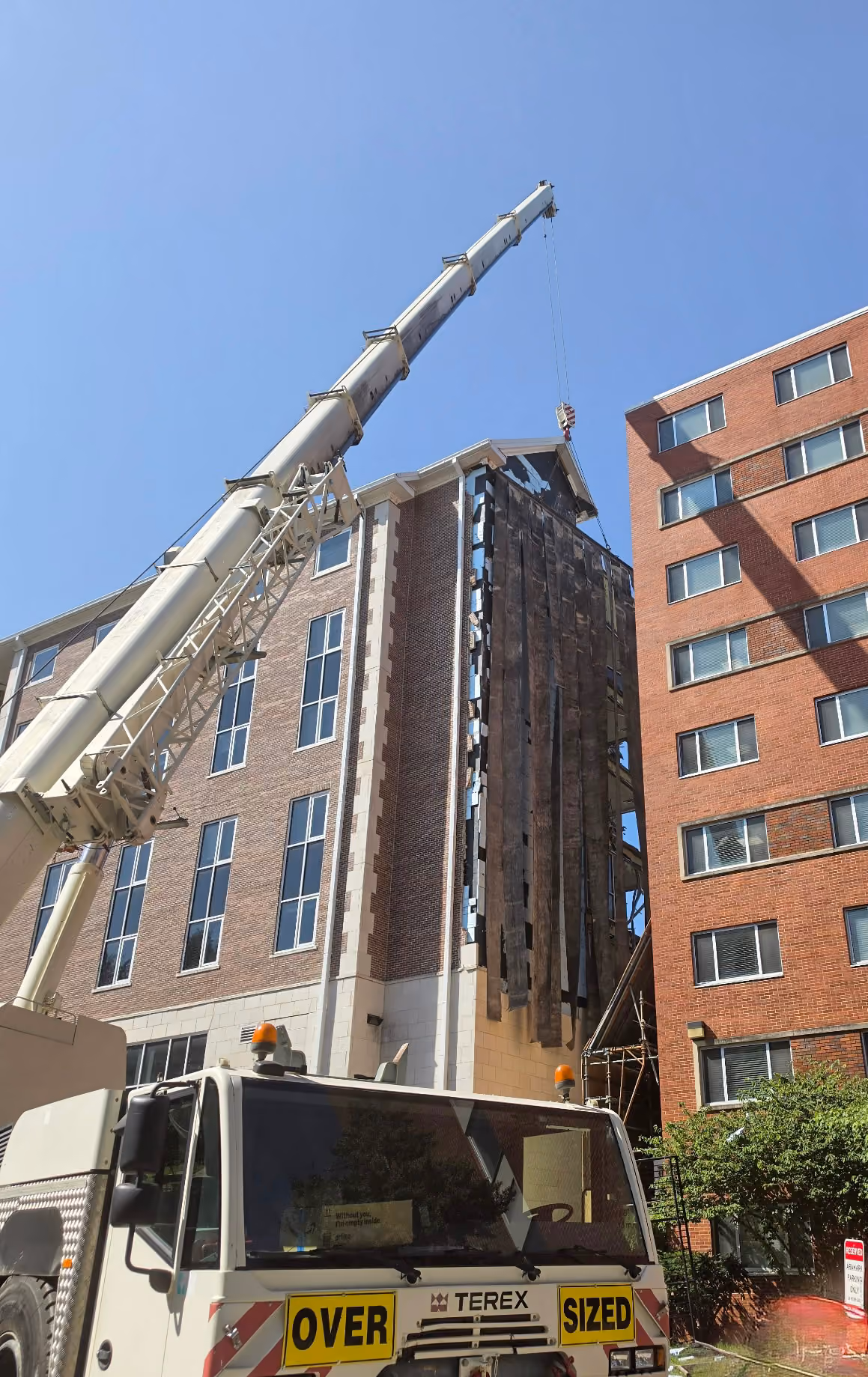 A TSR crane operator assisting with the demolition of a WKU campus building
