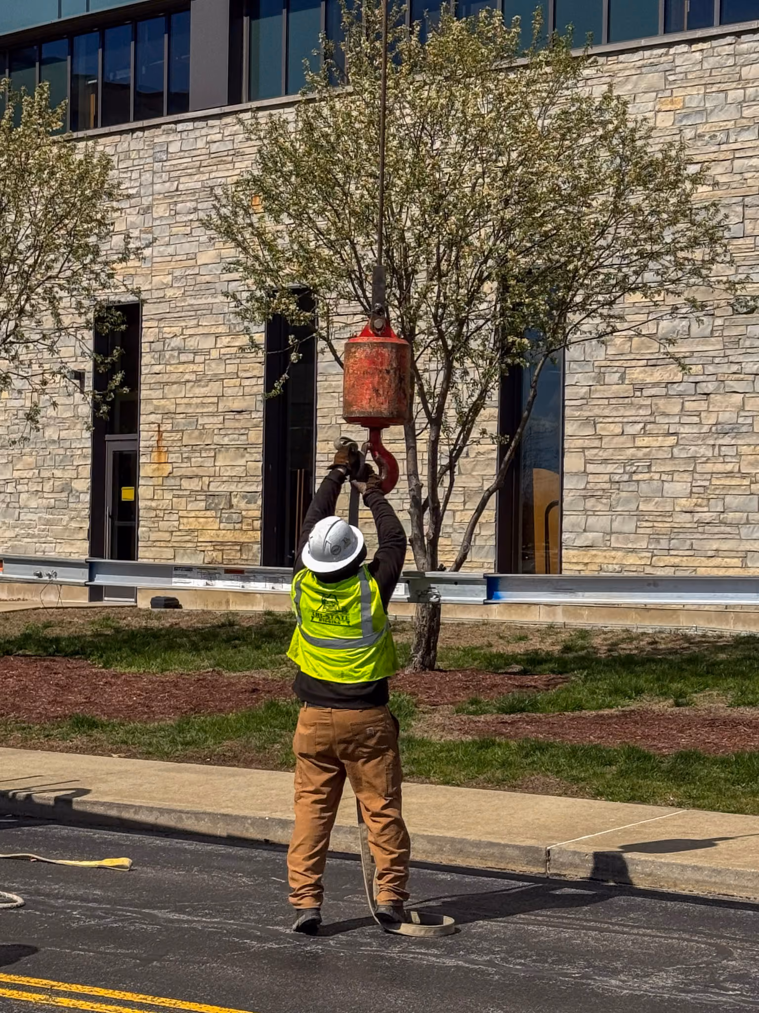 A TSR employee removing material from a crane hook
