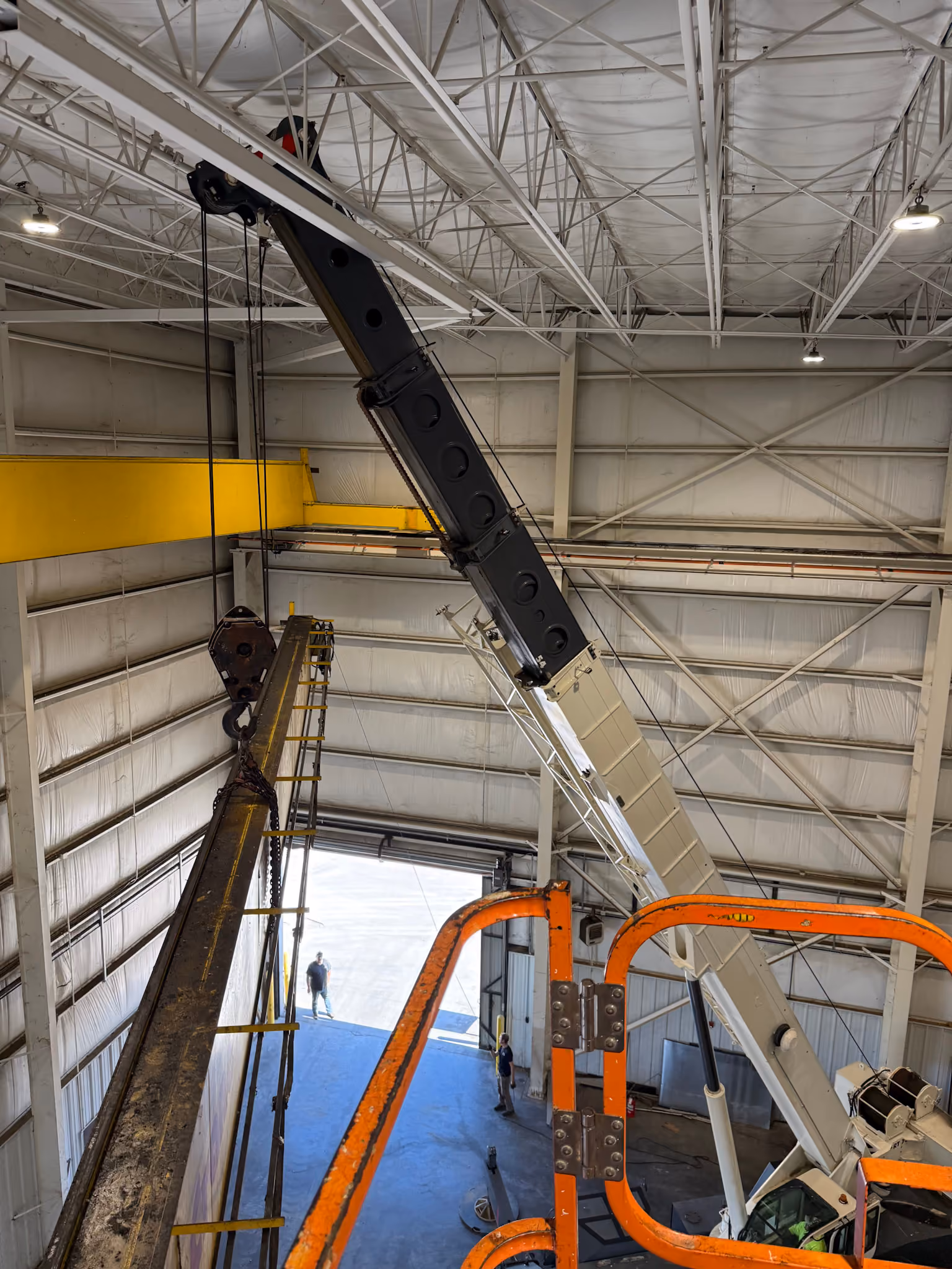 An overhead crane being disassembled