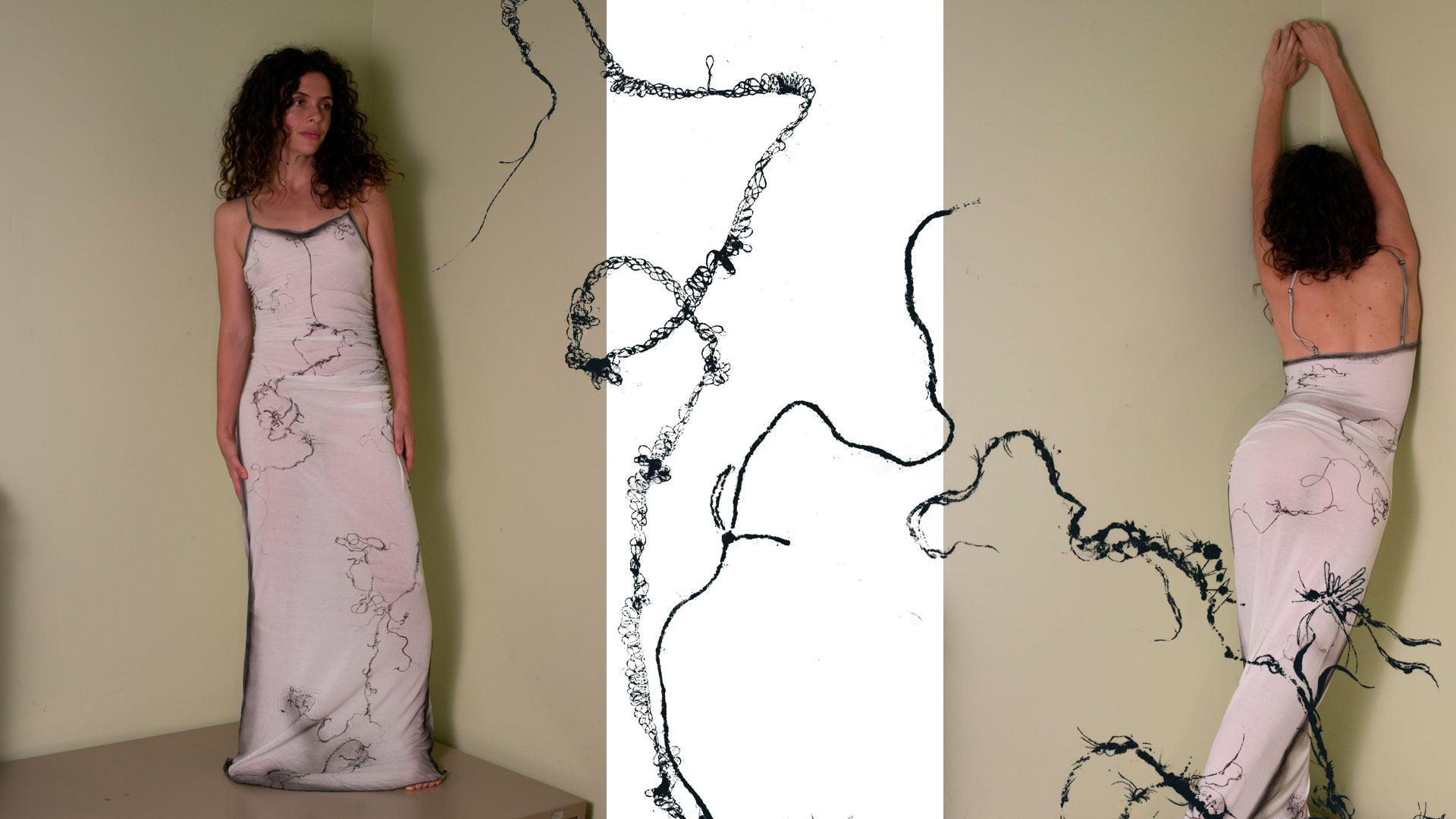 Woman with curly hair in a sleeveless white dress with black abstract floral patterns standing and stretching against a beige wall.