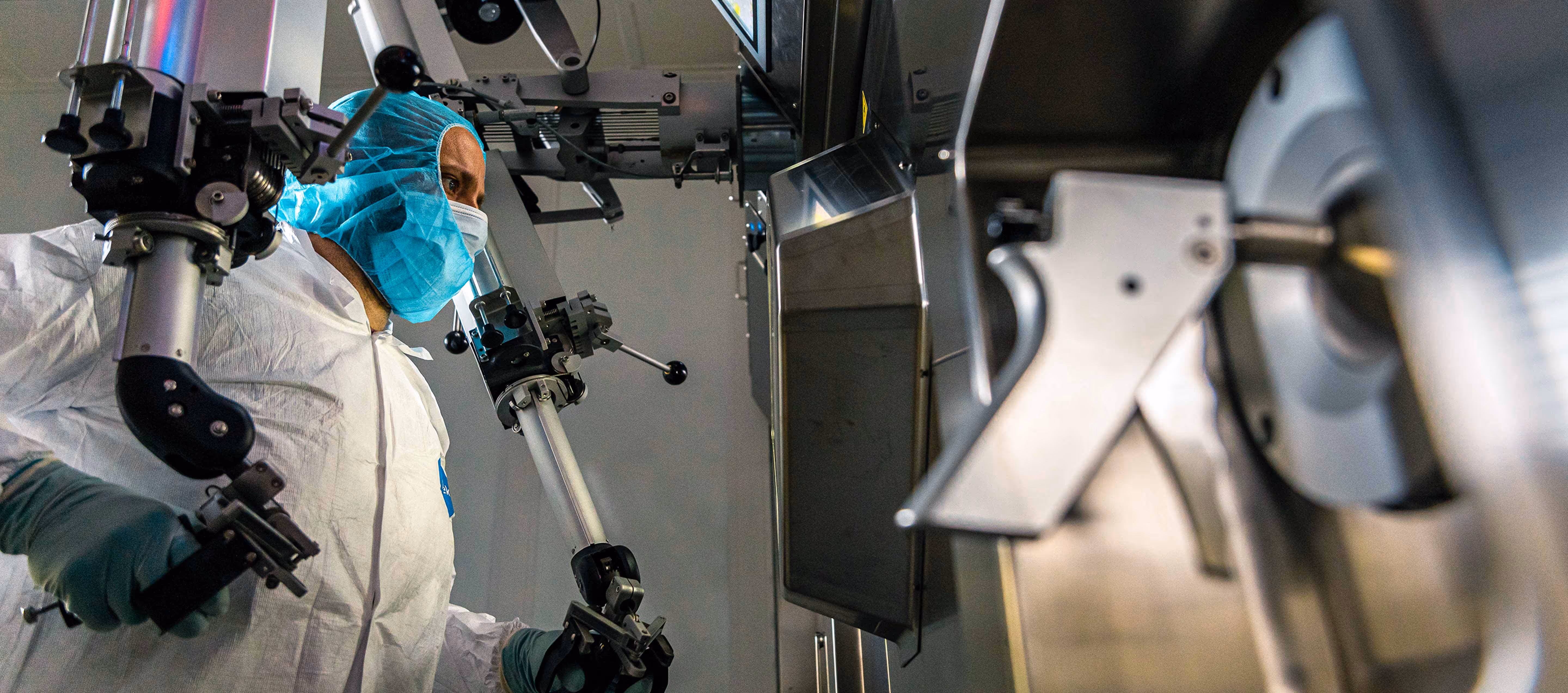 A researcher is creating radioactive isotopes inside the radiopharmacy