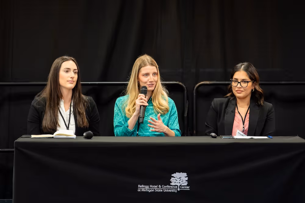 Sadilek, speaks with Kaur, and Sam Shook, a second year medical student, about the work of the MSU SAFE chapter. Photo credit Bryan Esler.