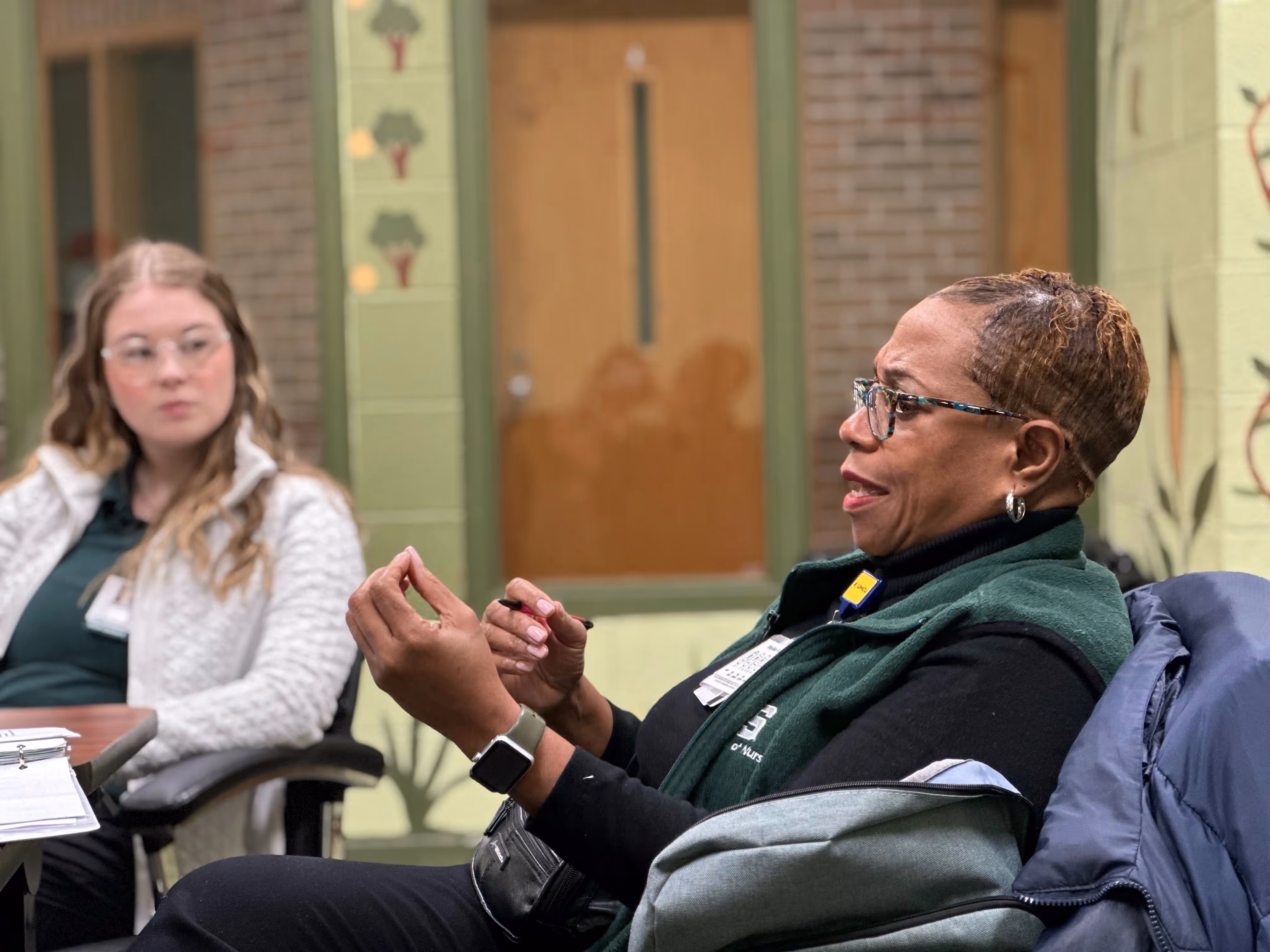 MSU Nursing Professor Rhonda Conner-Warren talks with students in her community health course before they begin their clinical day at Focus: HOPE in Detroit.