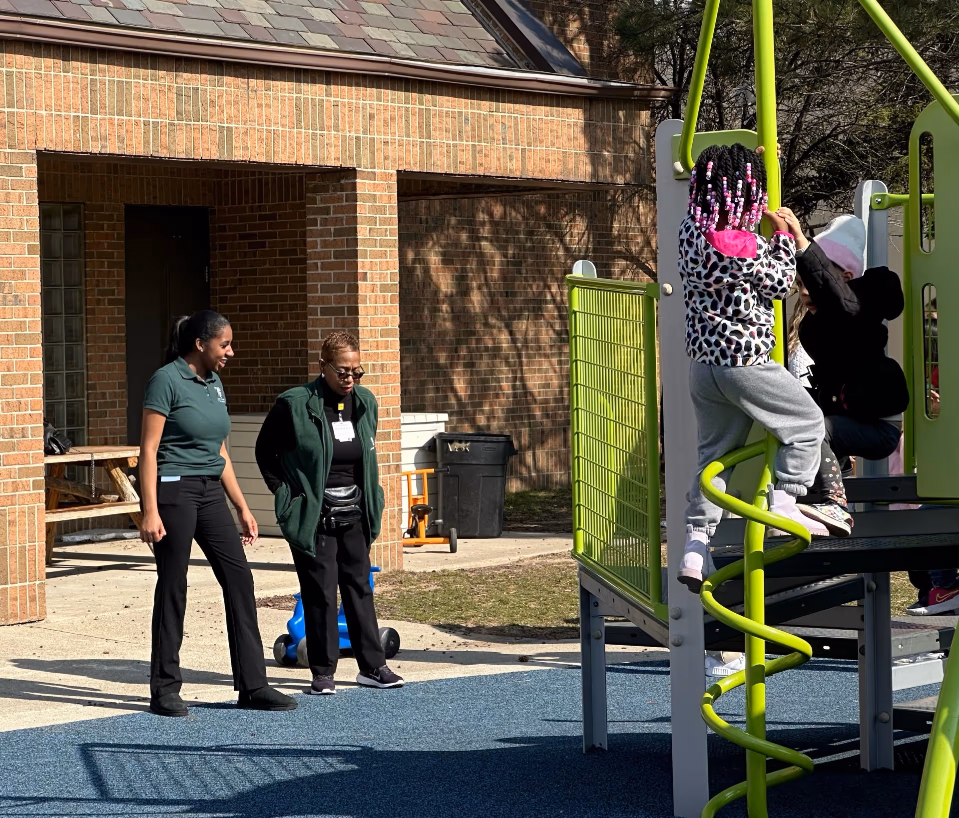 Rakala Todd, a fourth-year nursing student, chats with Professor Rhonda Conner-Warren on the playground at Focus: HOPE in Detroit.