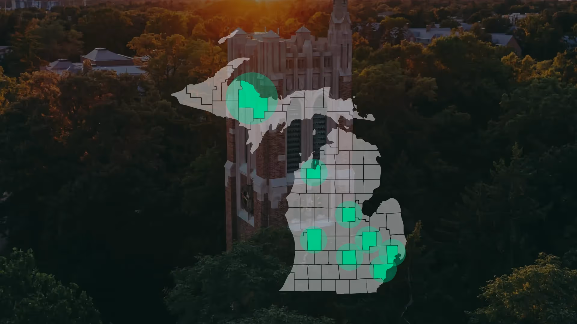 map of Michigan with highlighted regions overlaid on an aerial view of a historic campus tower at sunset