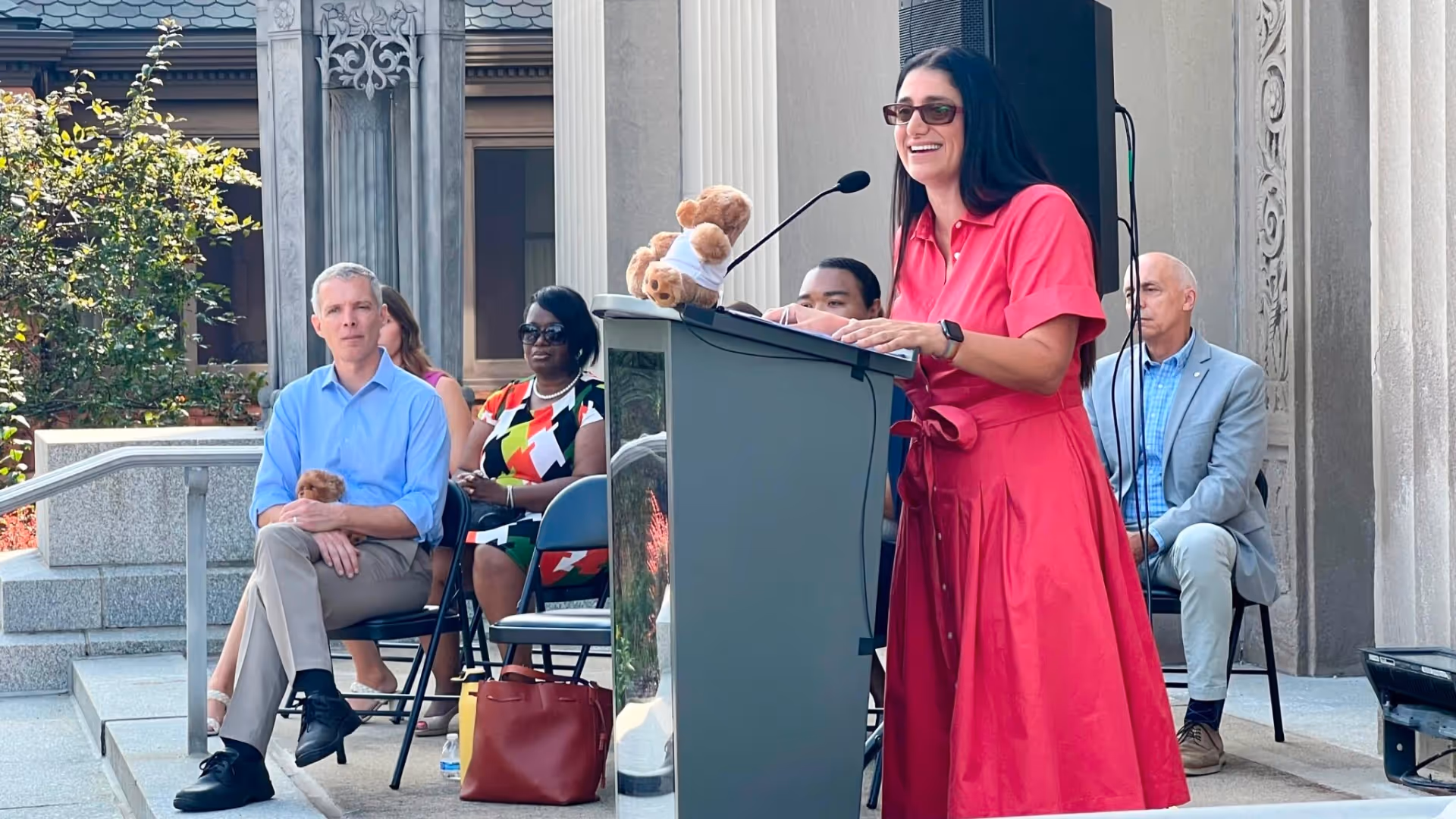 Dr. Mona Hanna-Attisha speaks from podium. 