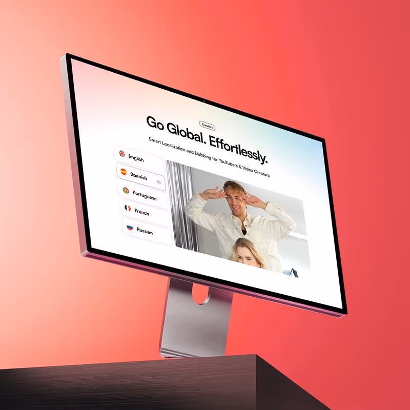 Computer monitor displaying a video localization platform with language options and a video of two people posing.