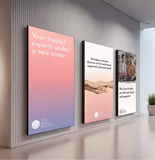 Three vertical posters on a wall displaying messages about trusted experts, support, and empowerment with The Dawn Practice logo.