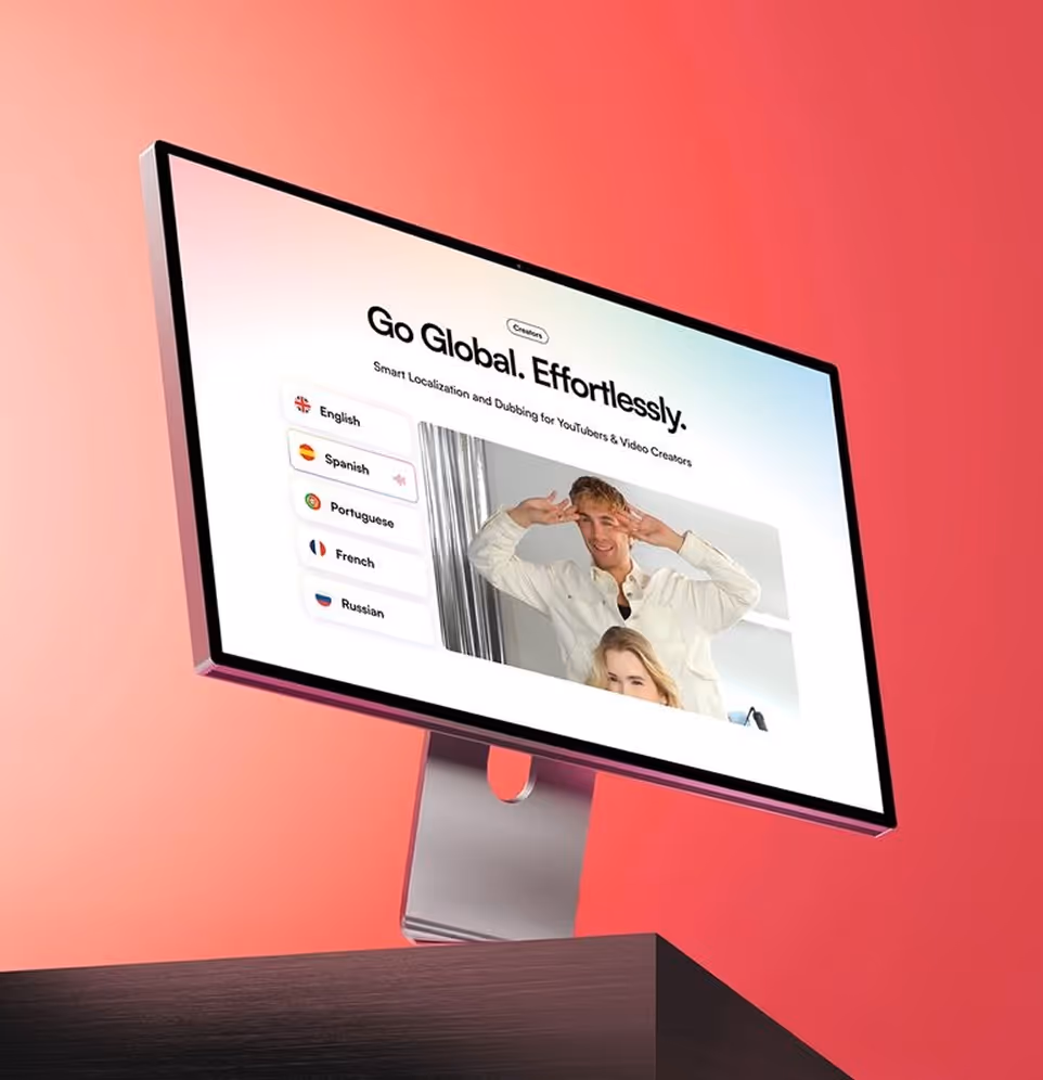 Computer monitor on a desk displaying a video localization interface with language options and the text 'Go Global. Effortlessly.'