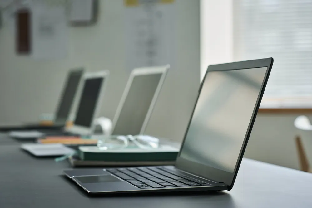Office laptops set aside for assessment under laptop recycling services in Singapore