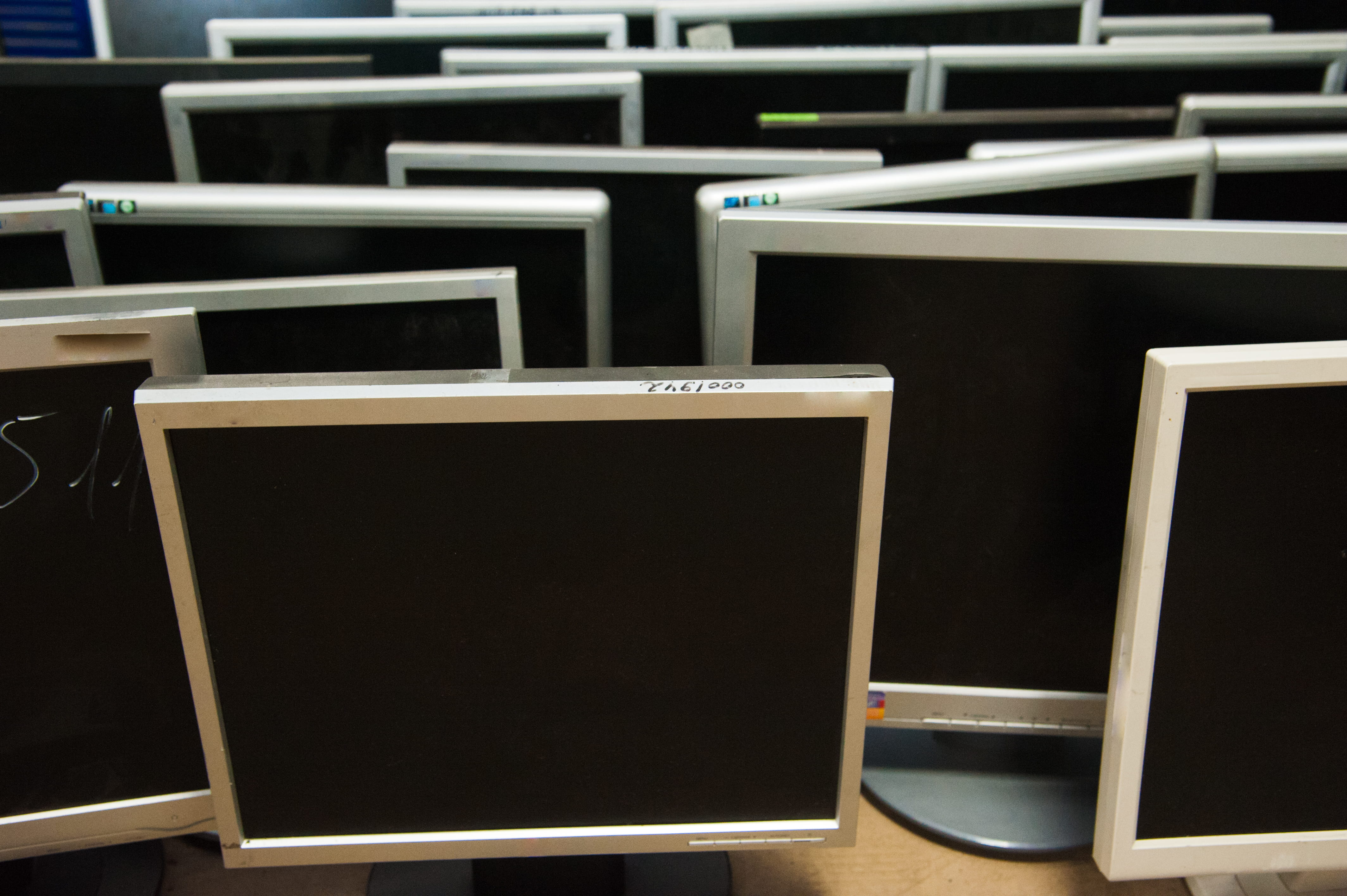Used LCD monitors prepared for secure IT asset disposal in Singapore and responsible electronic recycling