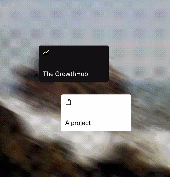 Blurred background of rocks and water with two overlay cards: a black card labeled 'The GrowthHub' with a chart icon and a white card labeled 'A project' with a document icon.