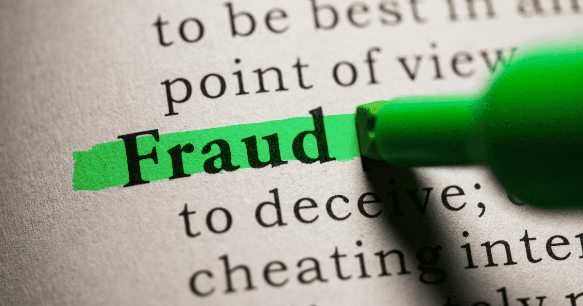 The word "Fraud" highlighted on a book