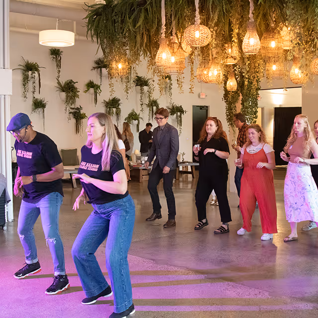 A group of people dancing Salsa