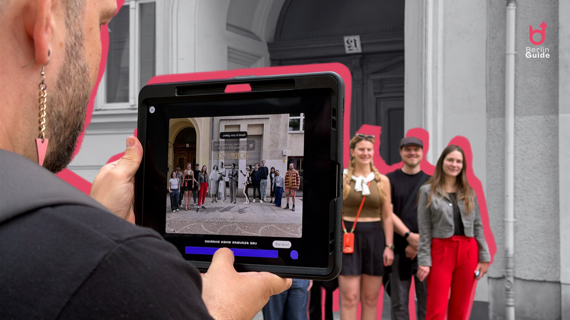 Jeff Mannes holds an iPad showing a ZAUBAR Mixie group photo with historical overlays during the Berlin Uncensored AR tour.