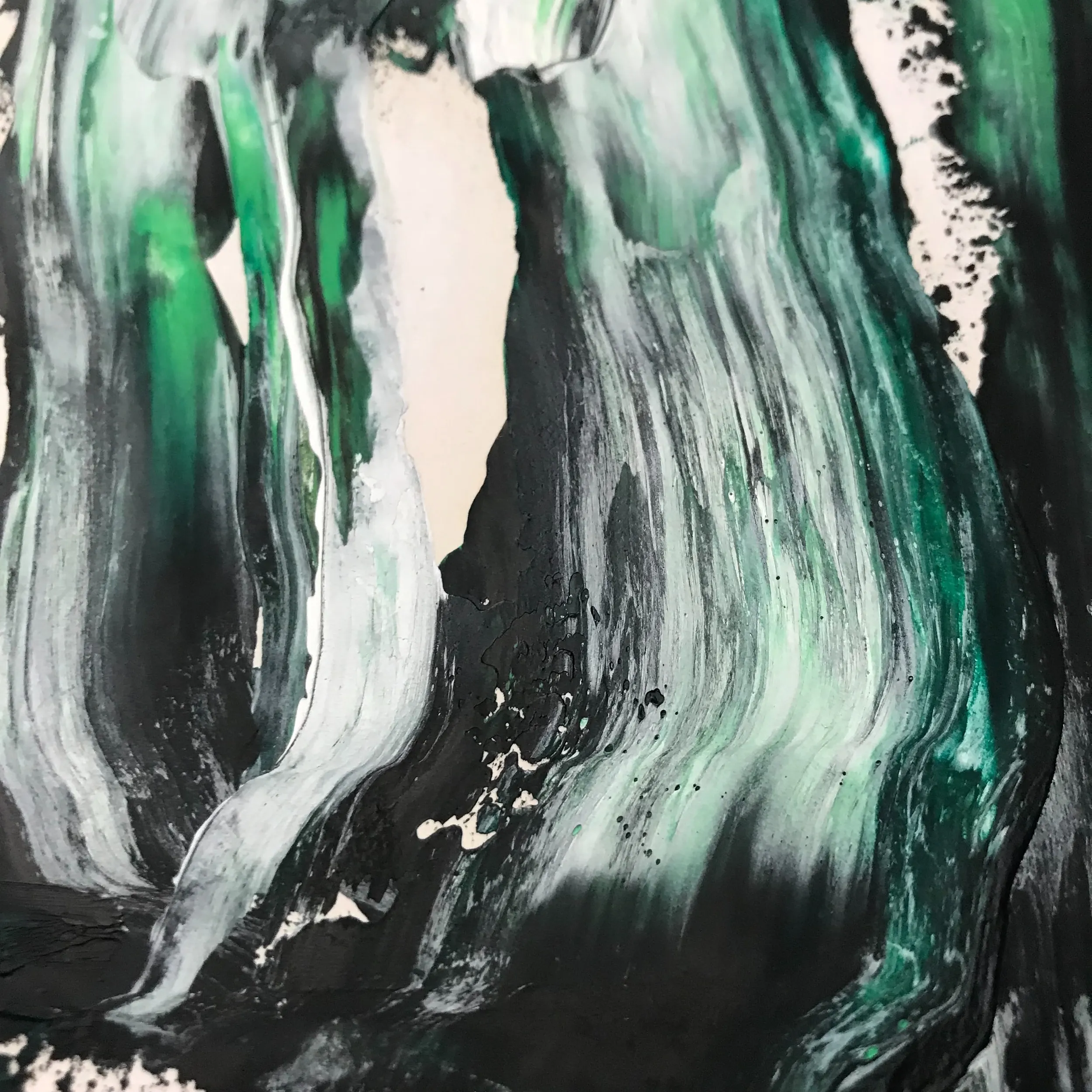A painting with green and white paint on it