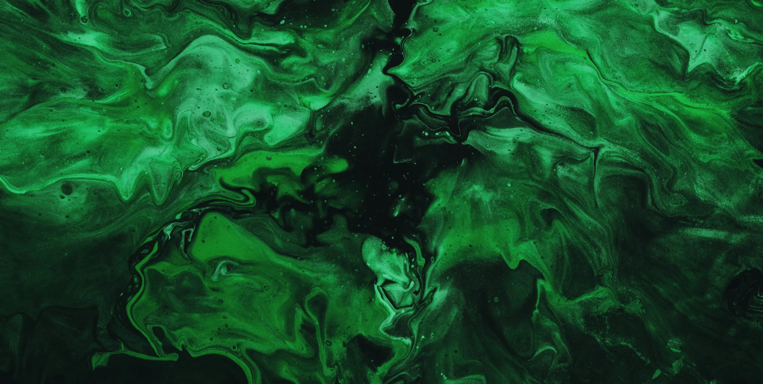 A green and black abstract painting