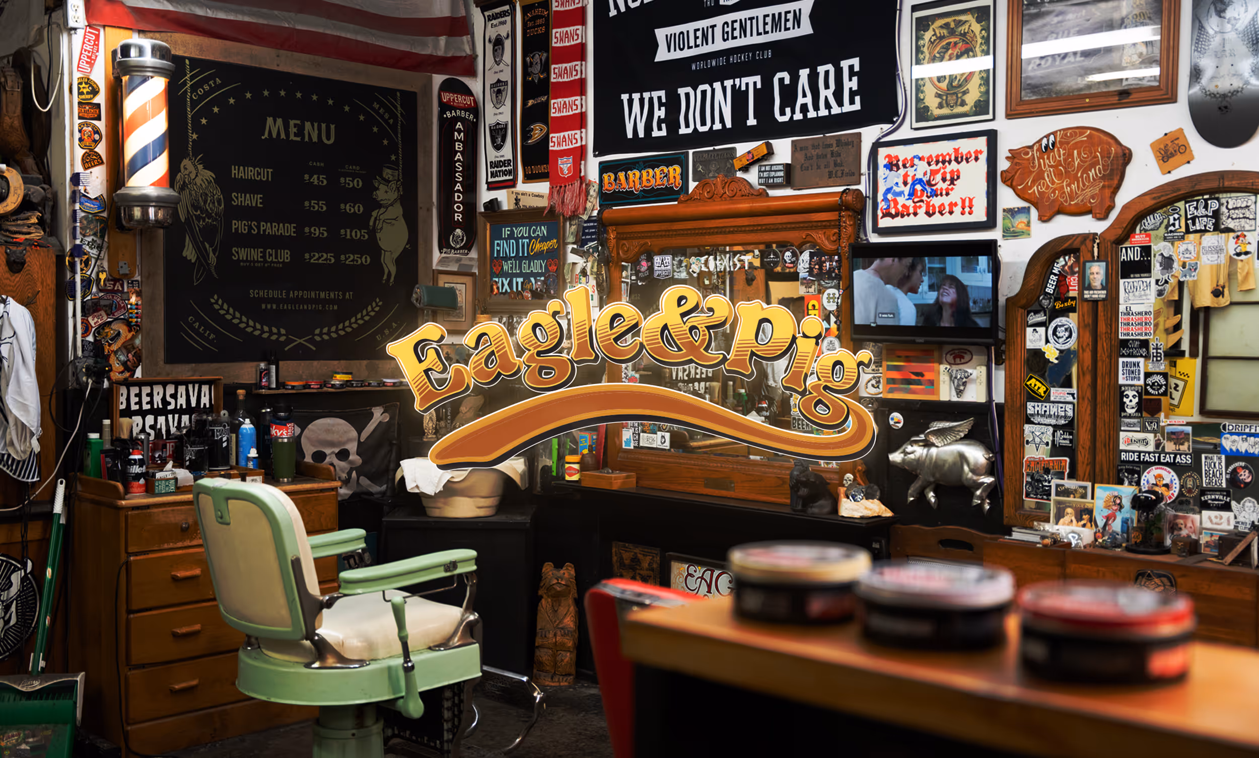Olds' client Eagle & Pig's website website home page hero showing their barbershop with the Eagle & Pig Logo