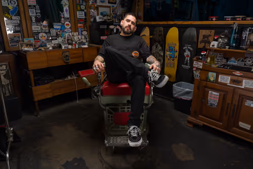 A cinematic image of a barber in his barber chair