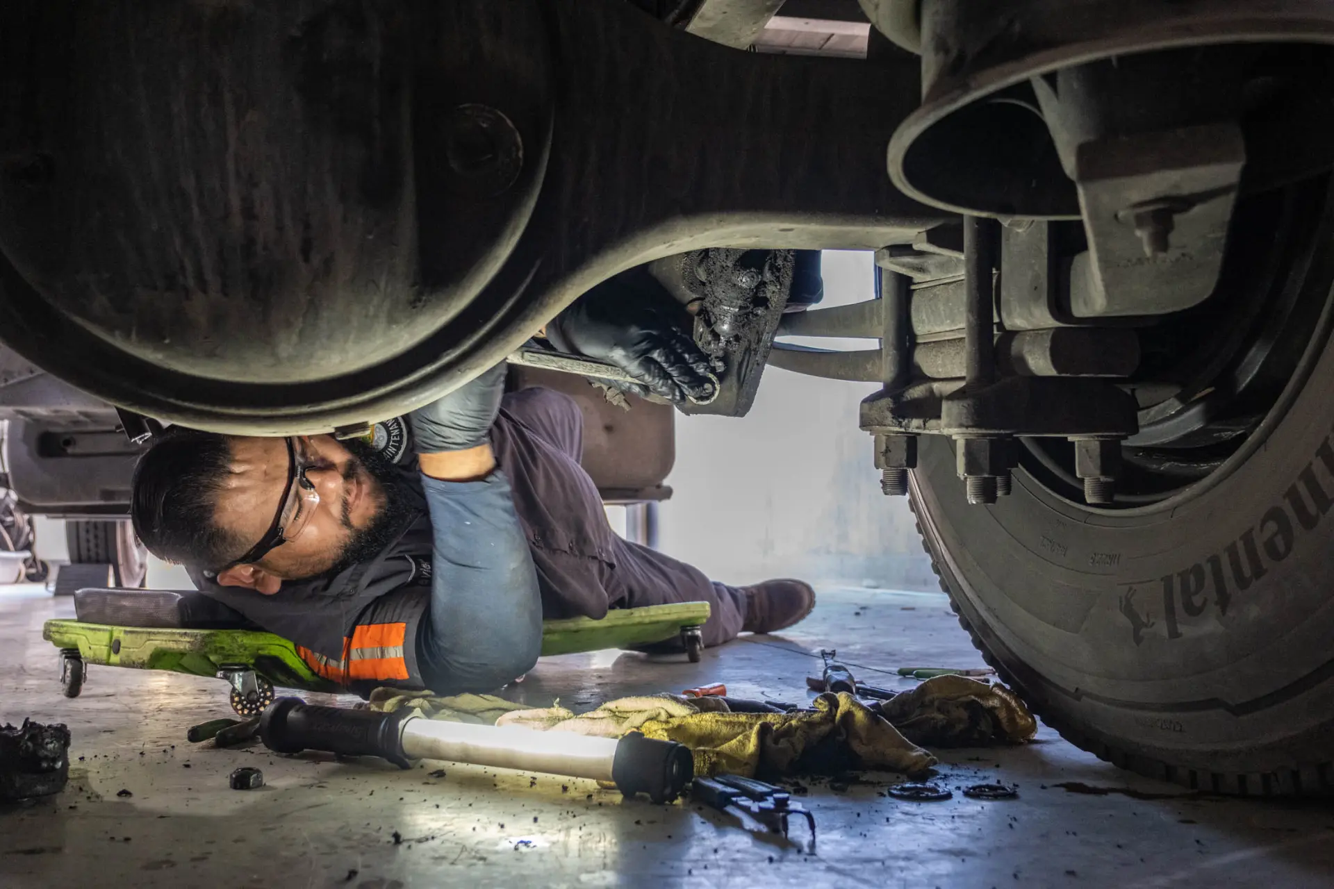 Diesel mechanic repairing truck in Loma Linda, CA