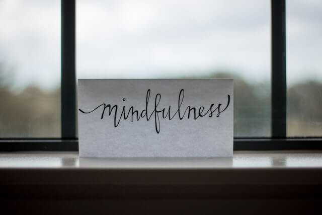 What is the difference between CBT and REBT?