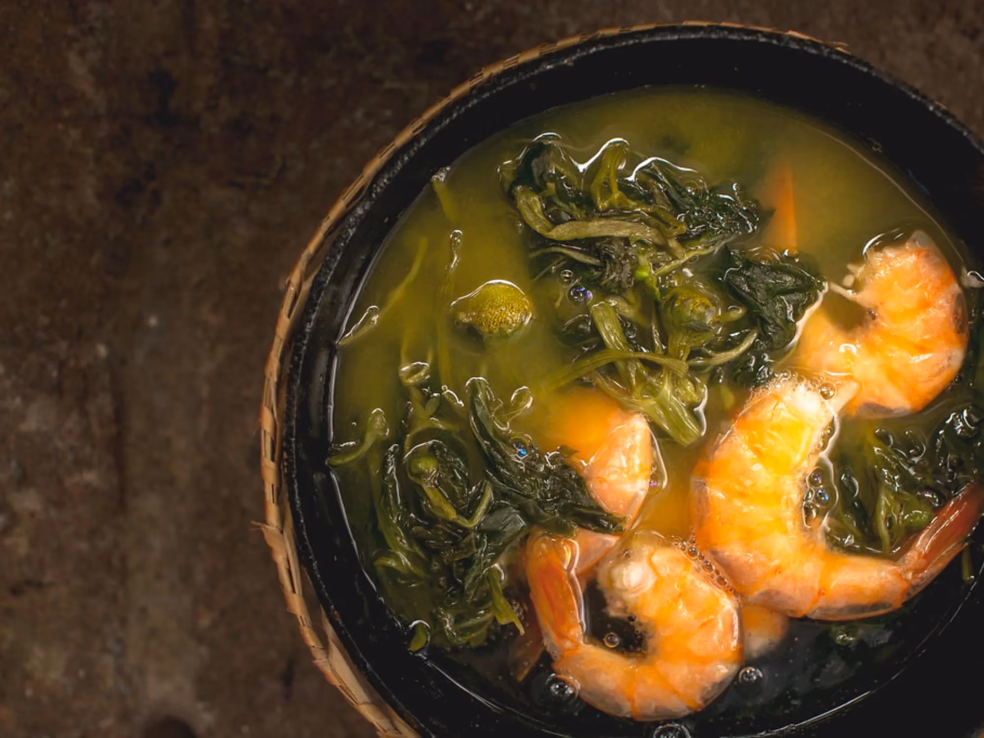 Bowl filled with shrimp and greens