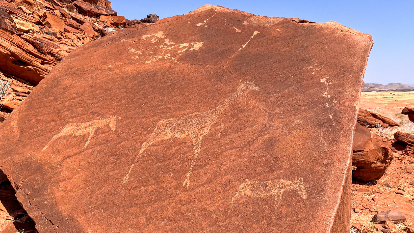 Petroglyphs carved into ancient rock in remote Namibia.