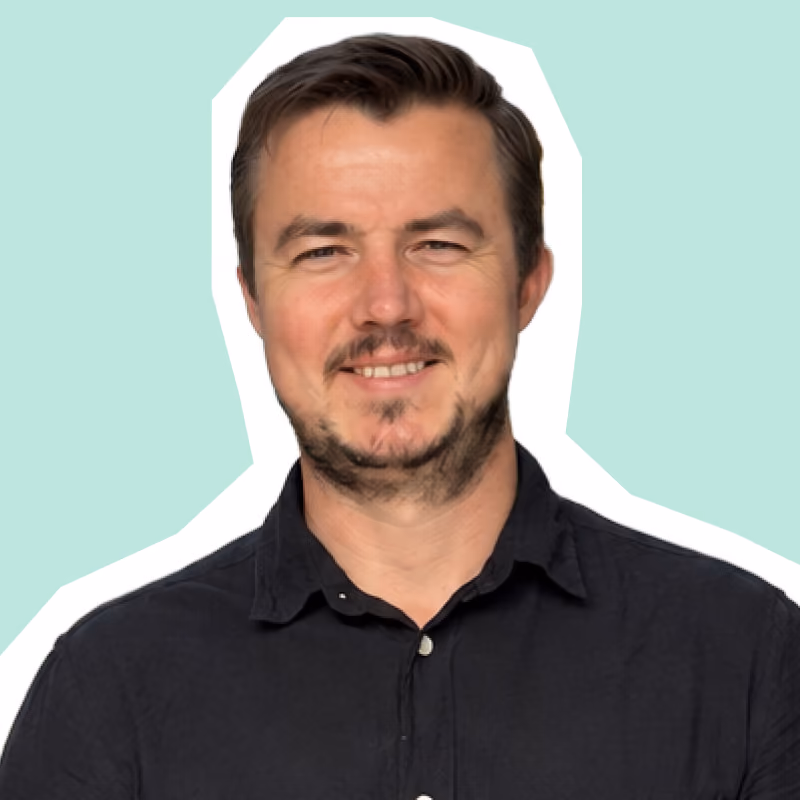 Henry Koekemoer, Lead Software Architect at koorvi, smiling in black shirt