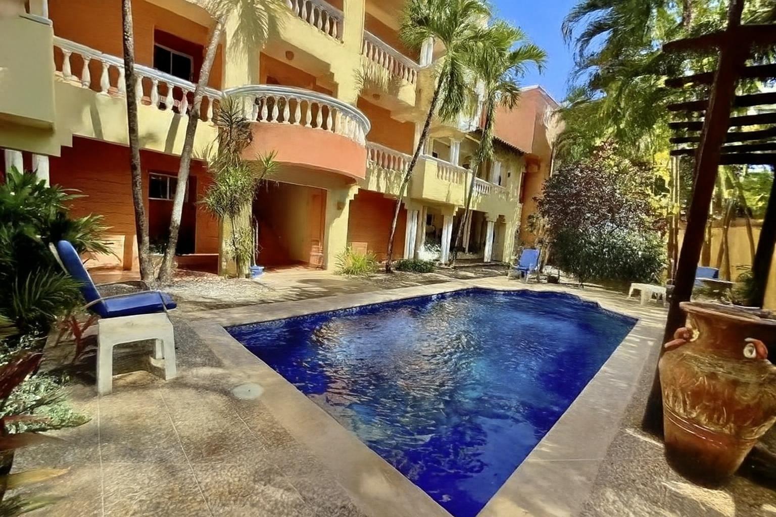 Garden View 1 Bedroom Condo with Beach Access in Perla Marina  4