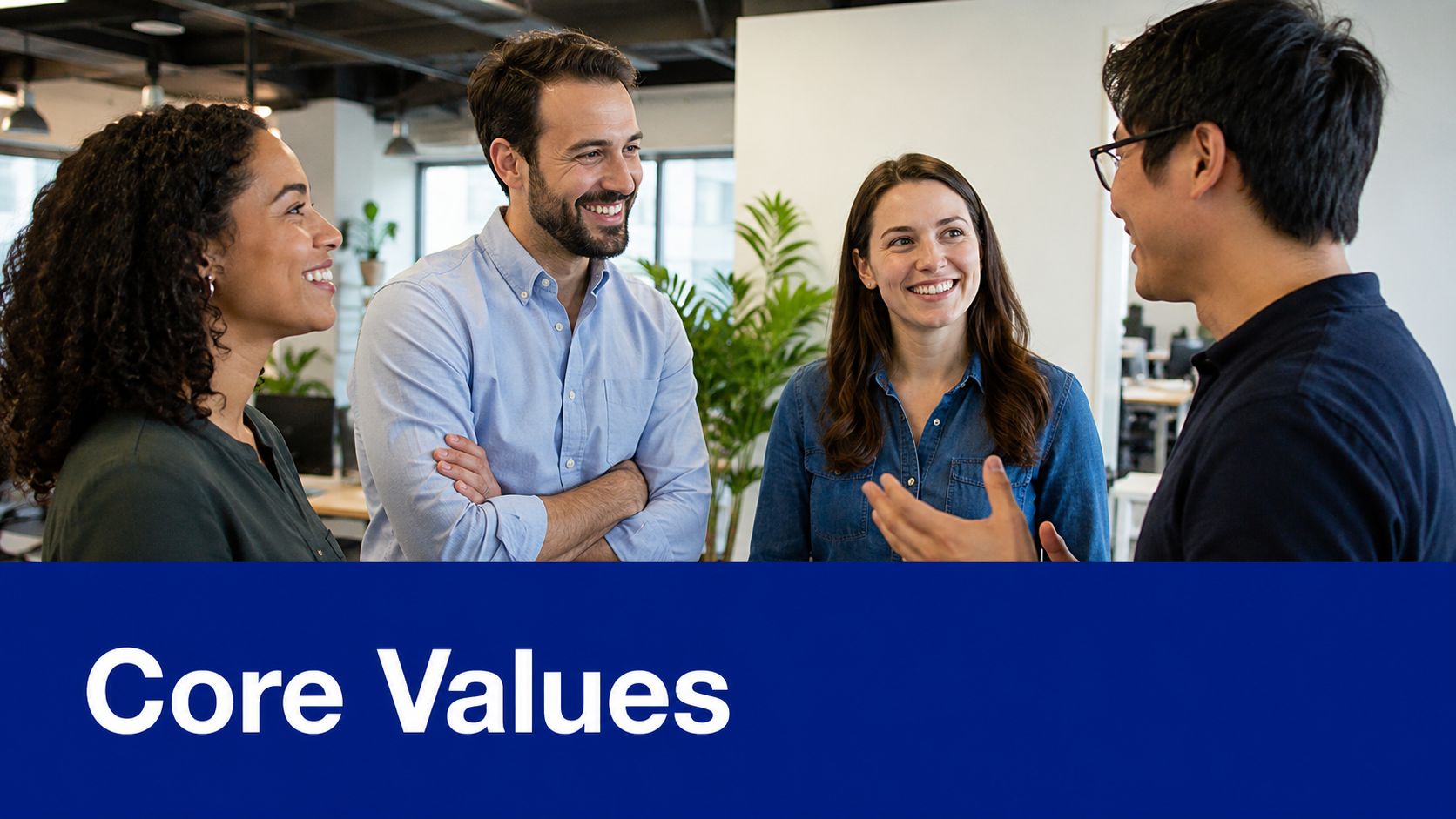 A diverse team of four colleagues smiling and collaborating in a bright modern office setting.