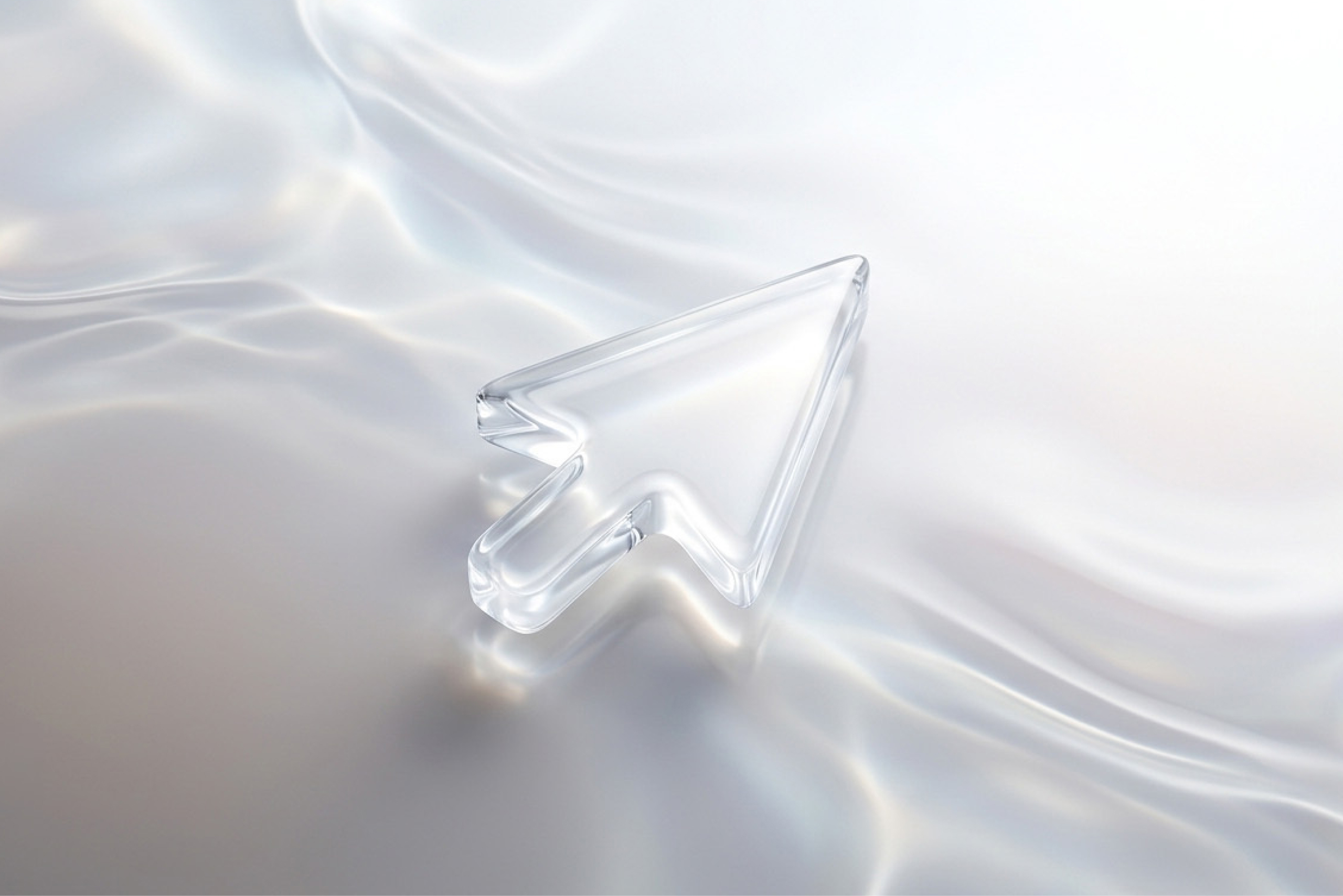 Ein transparenter Mauszeiger liegt auf einer hellen Oberfläche, die wie fließendes Glas wirkt. Das Bild steht für Trends im Fluss und für die Frage, welche Entwicklungen für Marken wirklich relevant bleiben.