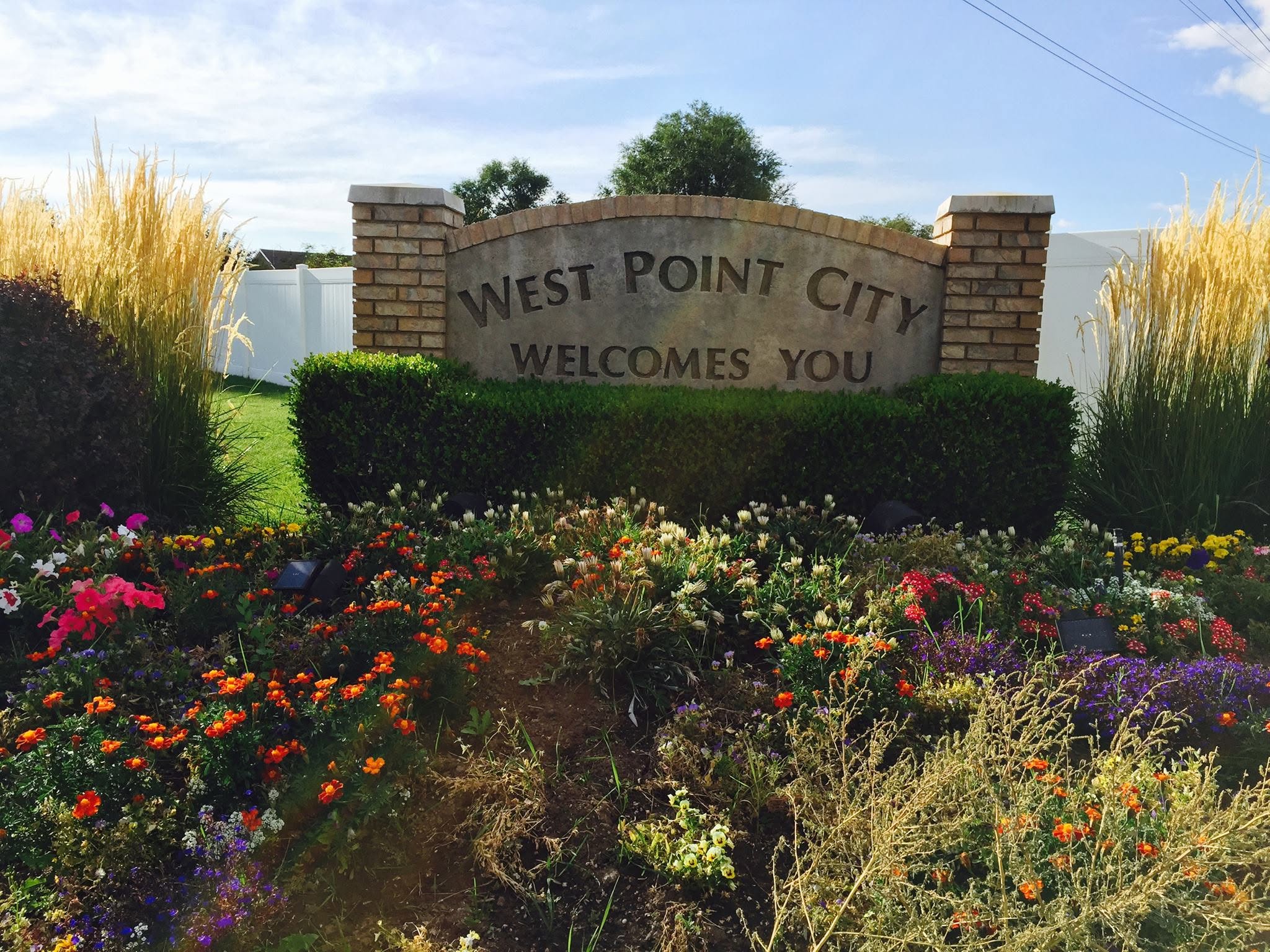 photo of welcome sign in West Point, Utah; images attribution West Point City
